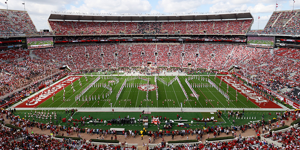Saban Field at Bryant-Denny Stadium with the band members spelling out Bama